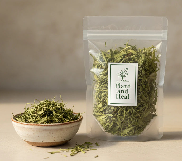Dry green leaves in a clear plastic bag with a bowl of the manglier leaves next to it. 