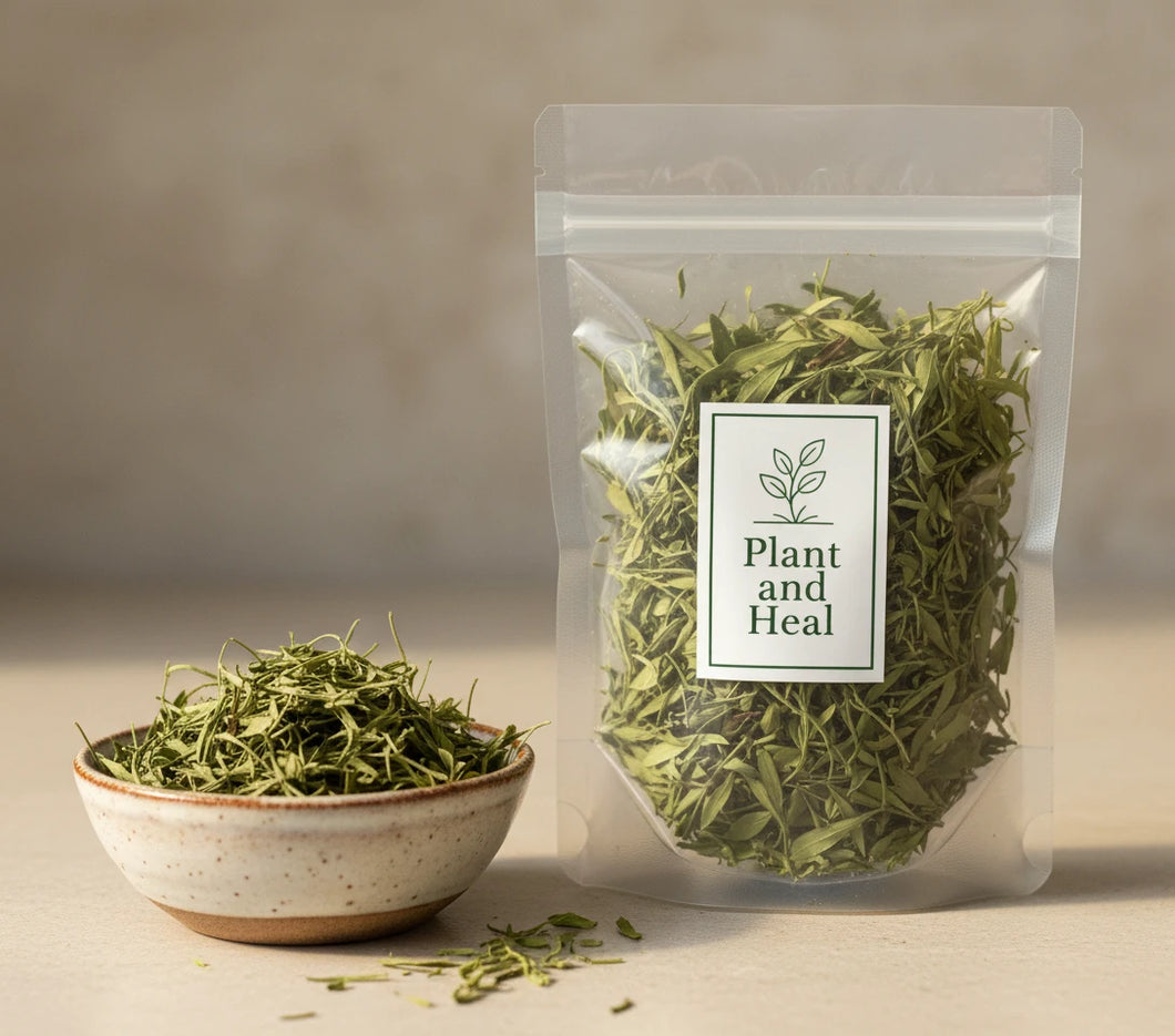 Dry green leaves in a clear plastic bag with a bowl of the manglier leaves next to it. 