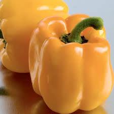 Golden-yellow bell peppers in close-up.